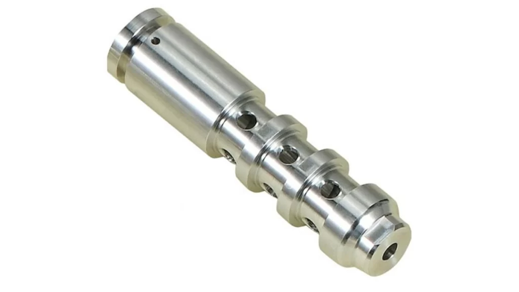 Steel machined component displaying fine details and smooth finish