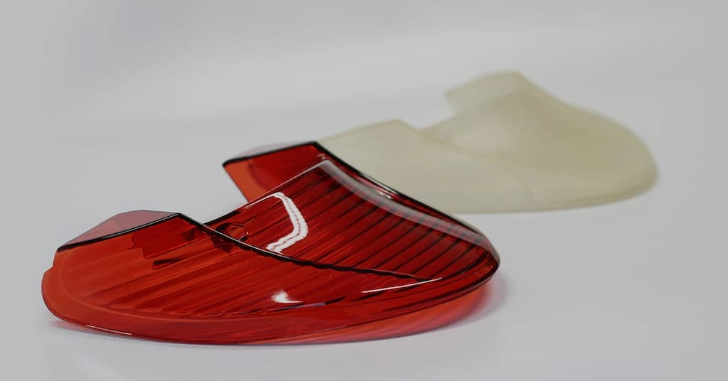 An image showing a vacuum cast tail light and a silicone mold