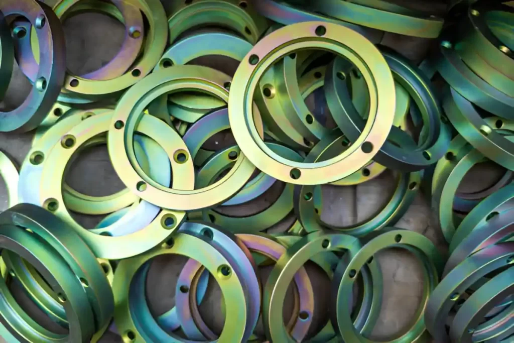 The image shows a set of vibrant machined anodized brass products.