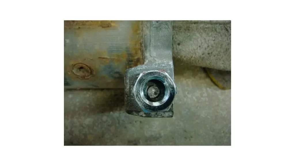 An image showing a nut being welded onto a broken stud to aid in its removal.