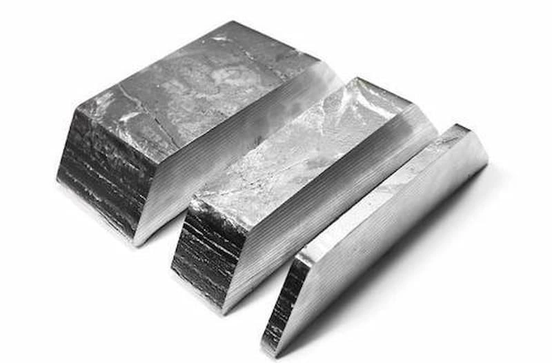An image showing three slices of pure zinc metal