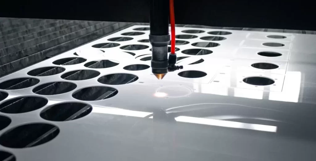 Laser cutting a cast acrylic sheet with precision circular patterns for custom fabrication work