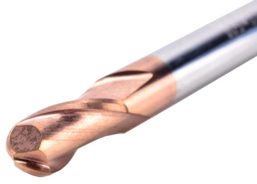 A close-up of a brown and grey ball nose solid carbide tool for profile milling