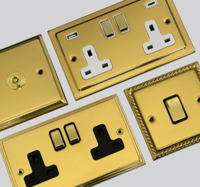 Brass electrical switch plates and socket outlets with decorative finishes