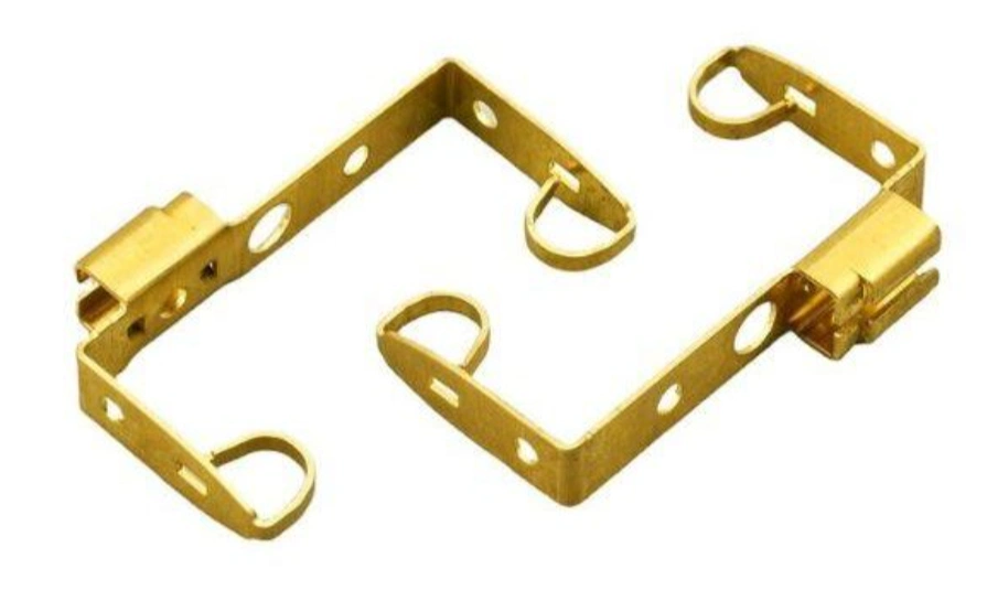 Brass-stamped metal brackets with mounting holes and formed tabs