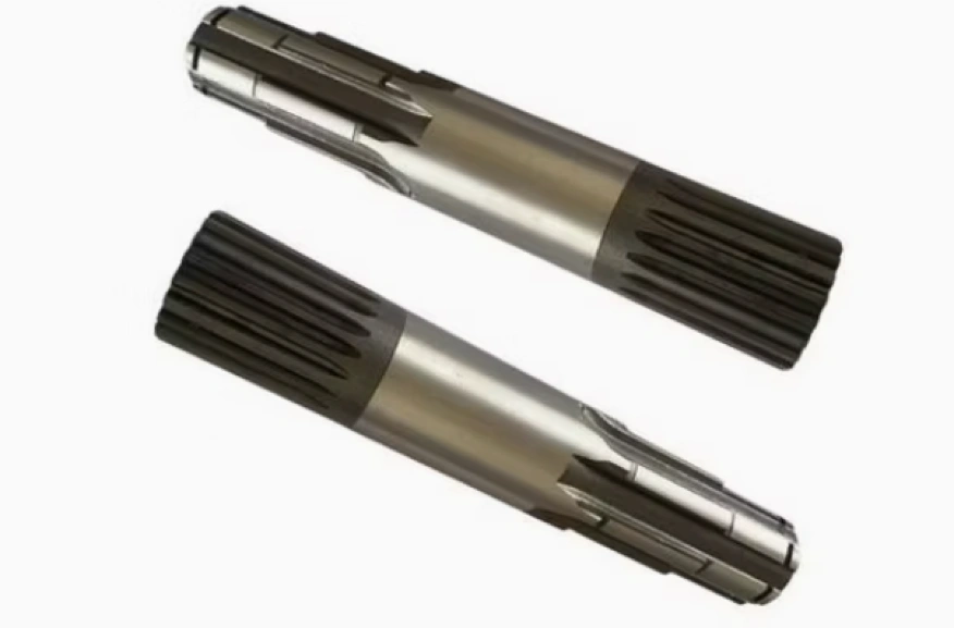 Two silver carbon steel shafts with different types of splines on each end