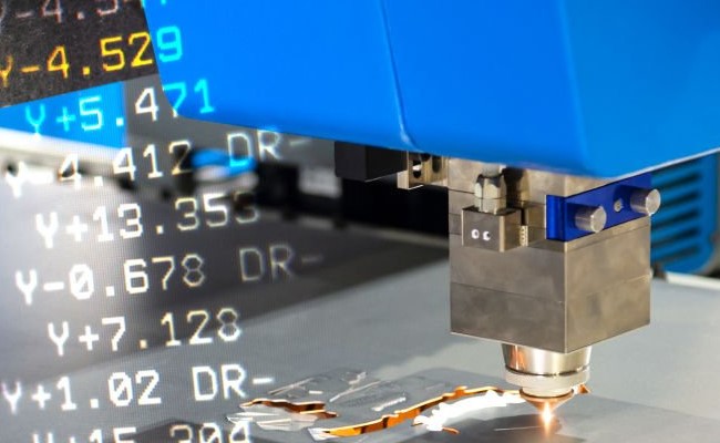 An image showing a CNC laser cutting machine cutting sheet metal alongside some G-code 