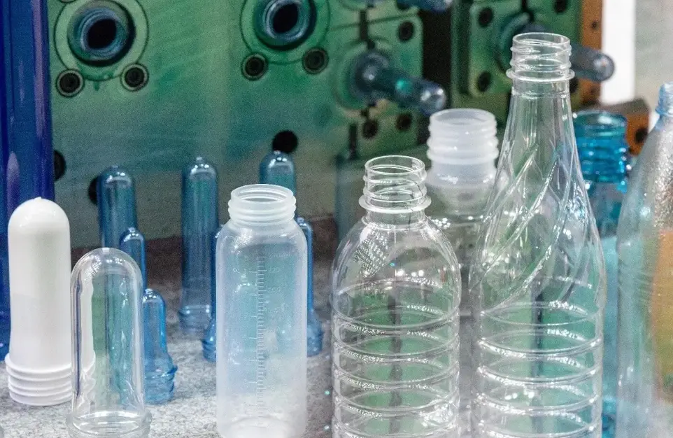 Several transparent and colored plastic bottles made by injection molding