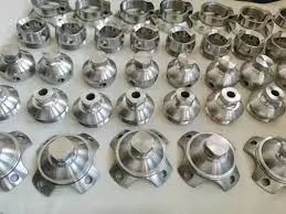 Shiny, lightweight metal parts arranged neatly on a surface.