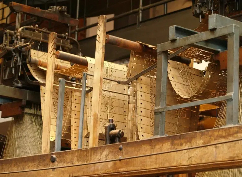 Vintage mechanical punched card programming system for early automated machinery