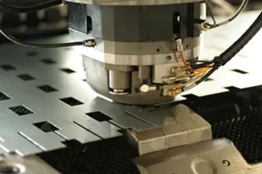 An image of a punching tool assembling punching slots in a sheet metal