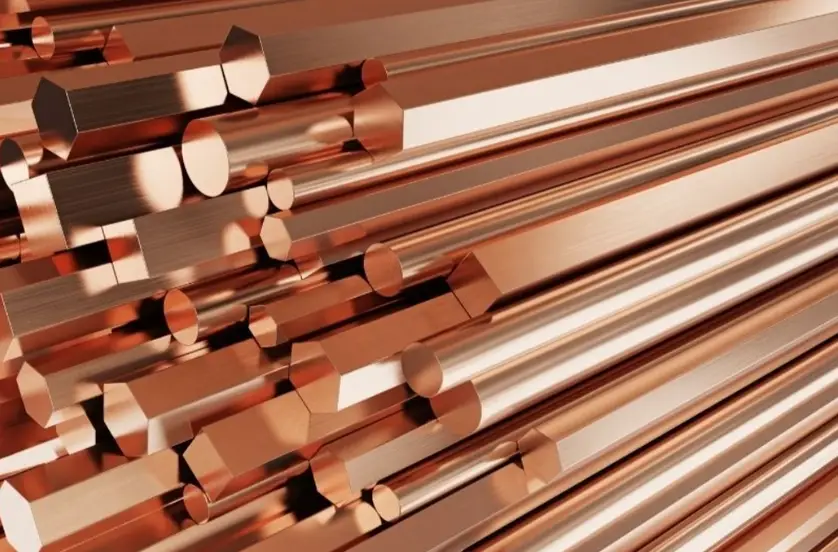 Hexagonal red brass bars with smooth surfaces and sharp, well-defined edges