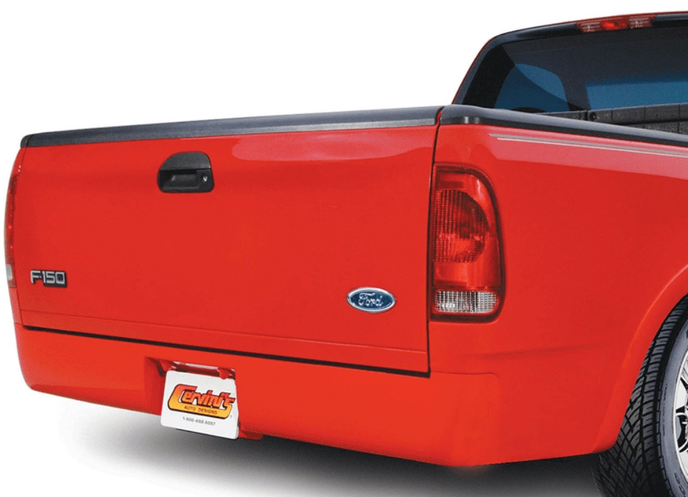 An image of the rear of a red pickup truck showing a roll pan bumper