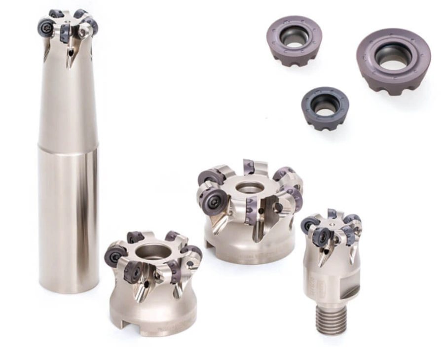 An image of grey and black round inserts of different sizes used for profile milling