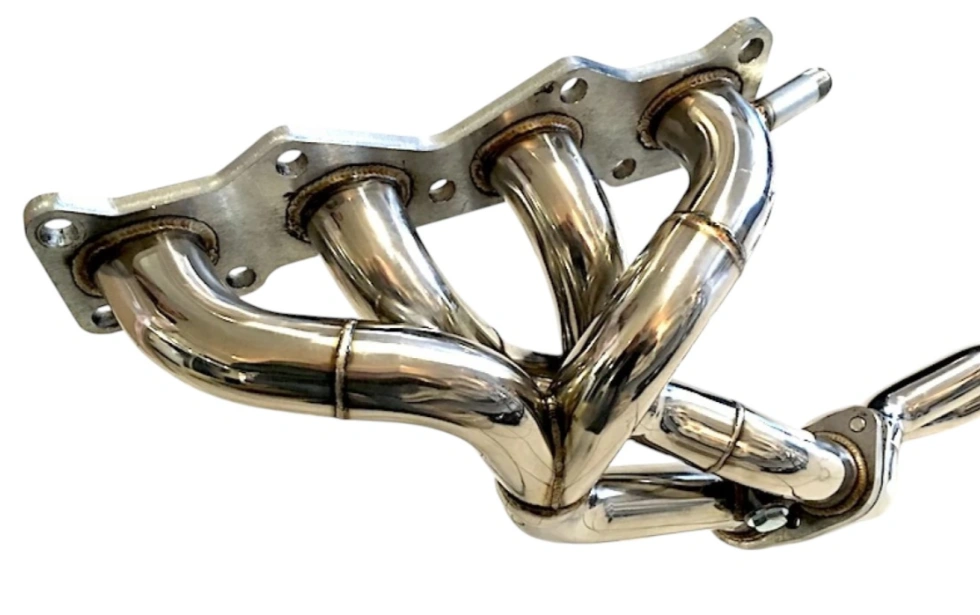 An image of a polished stainless steel exhaust manifold