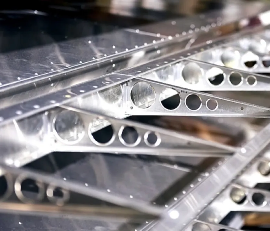 A closeup image of a section of an aircraft’s frame made of stainless steel