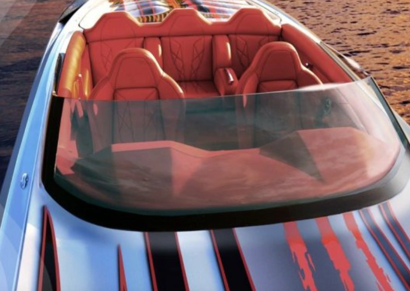 Thermoformed polycarbonate windshield on sports car with red interior