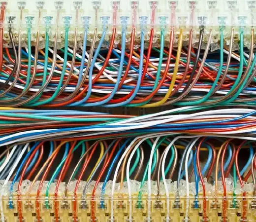 Multicolored thermoplastic insulated electrical wiring connected to terminal blocks