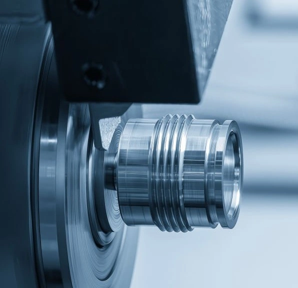 An image of a cylindrical metal component with threads at its middle section