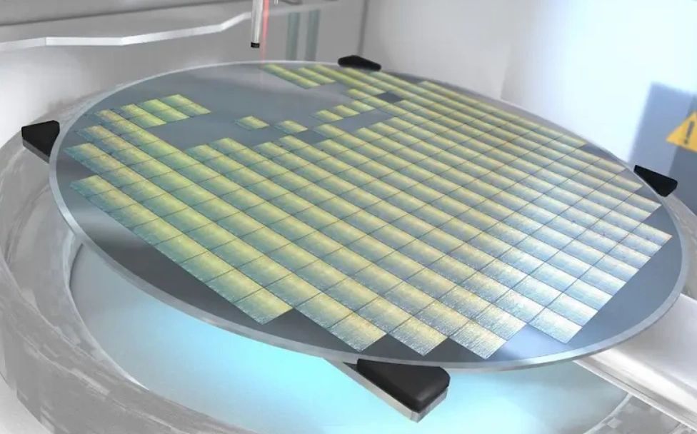 CNC-diced ceramic semiconductor wafer with grid pattern showing individual chip dies on a vacuum chuck