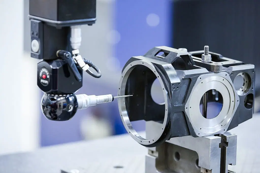 Tight tolerance CNC machining inspection of precision metal components.