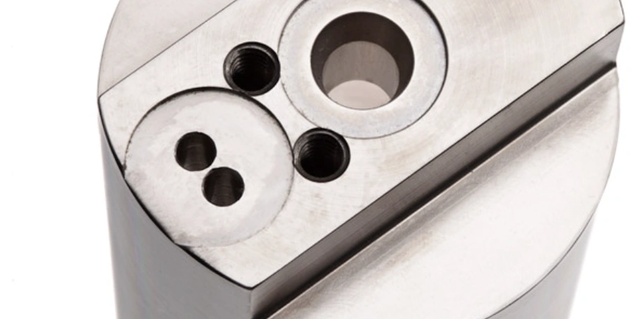 Precision holes of varying sizes machined in a metal component using EDM