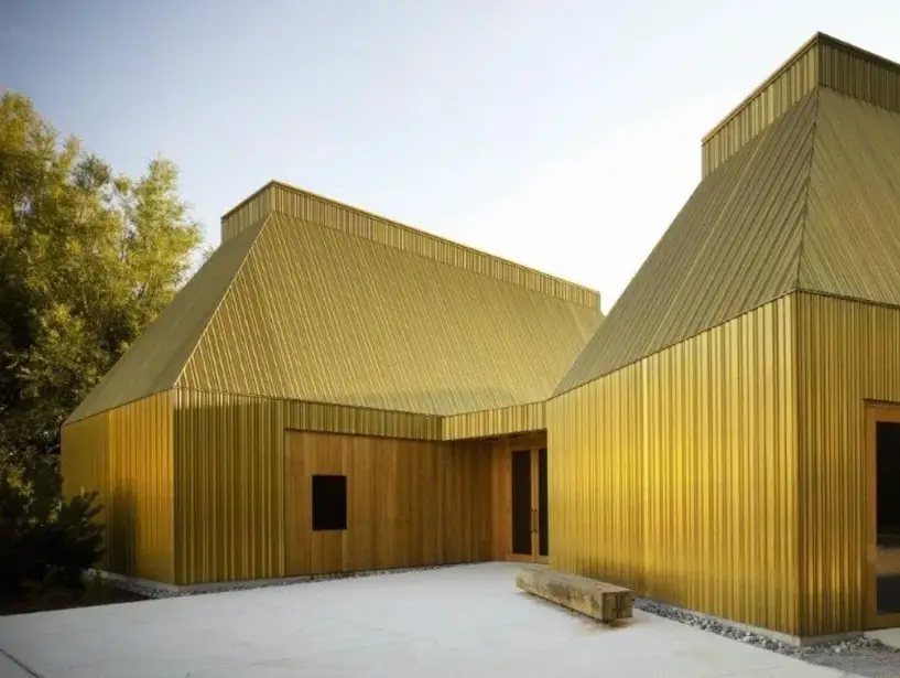 A house with bright yellow facade all over it